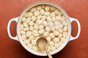 gnocchi being boiled in a pot of water