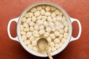 gnocchi being boiled in a pot of water