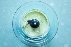 Creamy oregano salad dressing in a blender made with olive oil, mayonnaise, jalapeño, lemon juice spices and parmesan