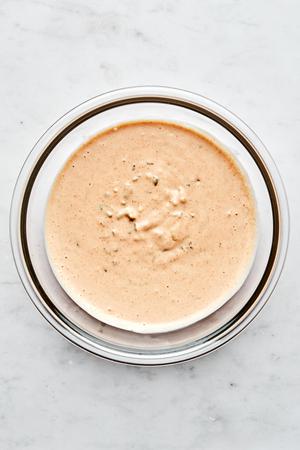homemade thousand island dressing made with mayonnaise, ketchup, relish, paprika, lemon juice, onion, garlic, salt & pepper