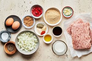 onion, garlic, brown sugar, Worcestershire, tomato paste, ground turkey, bread crumbs, milk, eggs & seasonings in bowls