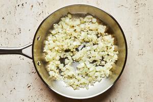 onion cooked in a pan in olive oil until softened then garlic added and cooked until fragrant