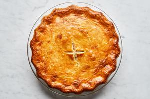 a homemade turkey pot pie filled with turkey, celery, carrot, onion, peas, thyme, salt, pepper and celery seed