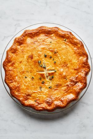 a homemade turkey pot pie filled with turkey, celery, carrot, onion, peas, thyme, salt, pepper and celery seed