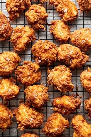 homemade chicken nuggets perfectly fried cooling on a cooling rack