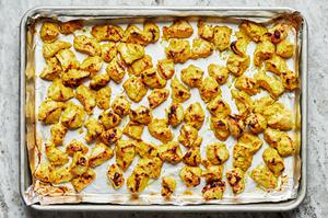 baked chicken that was marinated in yogurt, cayenne, garam masala, turmeric, cumin, garlic cloves, ginger, salt & lemon juice