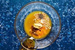 olive oil, vinegar, orange zest, orange juice, honey, Dijon, shallot, salt, and pepper in a glass bowl