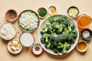raw broccoli, onion, butter, parmesan, heavy cream, chicken stock, garlic, chives and spices in prep bowls