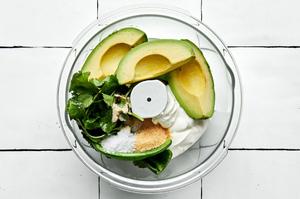 sour cream, avocado, onion powder, garlic powder, salt, cilantro, jalapeno, and lime juice in a food processor