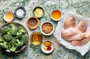 chicken, broccoli, whole grain mustard, dijon mustard, honey, curry powder, apple cider vinegar and spices in prep bowls