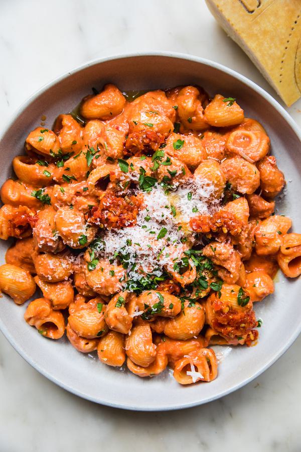 a bowl of homemade lemony Calabrian chili pasta topped with parmesan cheese and fresh parsley