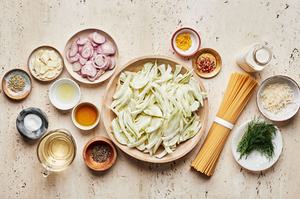 pasta, olive oil, spices, white wine, cream, lemon juice and zest, fennel and parmesan in prep bowls for pasta with fennel