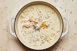 shallots, garlic, fennel seeds, white wine, heavy cream salt, pepper & lemon zest cooking in a skillet