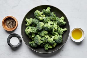 bowls of broccoli, olive oil, salt and pepper to make perfect roasted broccoli