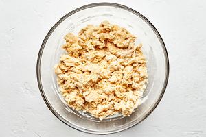 pierogi dough in a glass bowl made with flour, water, salt and oil