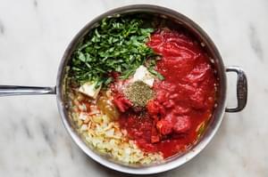 olive oil, onions, garlic, basil, oregano and bouillon in a pan