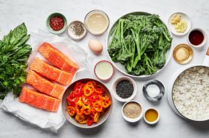 salmon, broccolini, peppers, rice, spices, fresh basil, chili paste, lime juice, tahini & sesame seeds in prep bowls