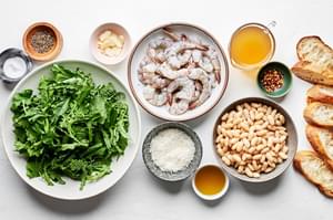 broccoli rabe, white beans, shrimp, olive oil, garlic, salt, pepper, red pepper flakes, chicken stock and parmesan in bowls