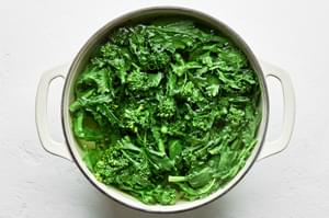 broccoli rabe being blanched in boiling water