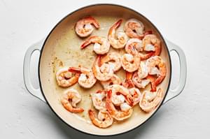 shrimp being cooked in a skillet