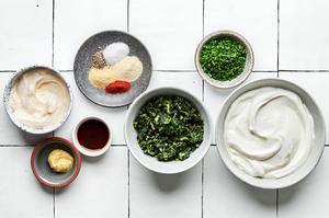 sour cream, mayonnaise, spinach, spices, worcestershire, dijon and chives in prep bowls to make spinach dip