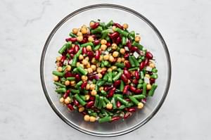 3 bean salad made with green beans, kidney beans, garbanzo beans, red onion & parsley all tossed with homemade vinaigrette
