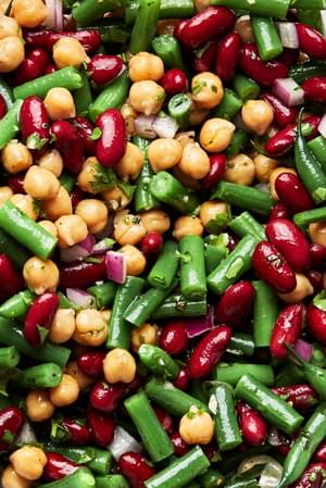 3 bean salad made with green beans, kidney beans, garbanzo beans, red onion & parsley all tossed with homemade vinaigrette