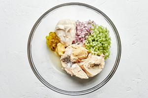 tuna, shallot, celery, relish, mayonnaise, Dijon, lemon juice and spices in a bowl to make tuna salad