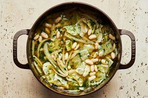 a pot of White Bean Soup with Dill and Cabbage made with fennel, cabbage, white beans, stock, spices and herbs