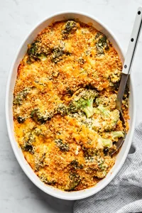 broccoli casserole made with  cream of mushroom soup, mayo, dijon, onion and egg topped with cheese and panko