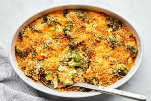 broccoli casserole in a baking dish made with cream of mushroom soup, mayonnaise and dijon topped with cheese and panko