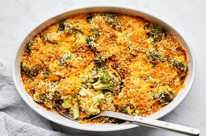 broccoli casserole in a baking dish made with cream of mushroom soup, mayonnaise and dijon topped with cheese and panko