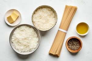 bucatini, extra-virgin olive oil, butter, pepper, Parmesan and Romano in prep bowls to make cacio e pepe