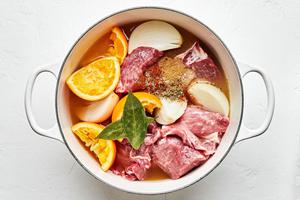 pork shoulder, chicken stock, orange & lime juice, onion & spices in a dutch oven to make carnitas