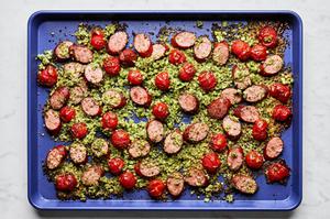 Cauliflower Rice Sheet Pan made with smoked sausage, pesto, cherry tomatoes, arugula, basil, salt & pepper