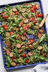 Cauliflower Rice Sheet Pan made with smoked sausage, pesto, cherry tomatoes, arugula, basil, salt & pepper