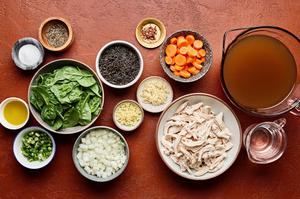 chicken, wild rice, chicken stock, onion, salt, pepper, carrots, spinach, garlic, ginger, spinach & green onions in bowls