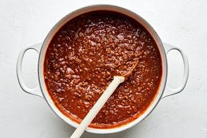 a pot of Cincinnati Chili made with ground beef, onion, garlic, tomatoes, spices, Worcestershire and unsweetened chocolate