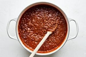 a pot of Cincinnati Chili made with ground beef, onion, garlic, tomatoes, spices, Worcestershire and unsweetened chocolate