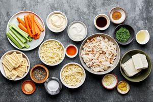 cream cheese, mayo, sour cream, spices, Worcestershire, lemon juice, hot sauce, cheese & crab meat in prep bowls
