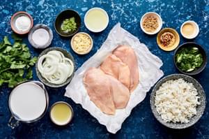 raw chicken breasts, salt, brown sugar, garlic powder, vegetable oil, onion, garlic, coconut milk, cilantro, lime, rice