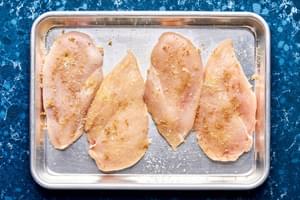 4 raw chicken breasts seasoned with salt, brown sugar and granulated garlic
