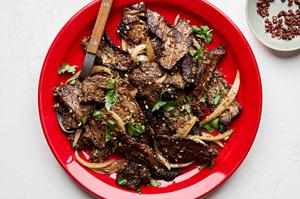 Cumin Beef Stir Fry on a plate topped with fresh cilantro