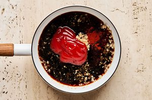 sweet and smoky huli huli sauce cooking in a small sauce pan to make huli huli grilled chicken