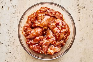 raw chicken marinating in sweet and smoky huli huli sauce