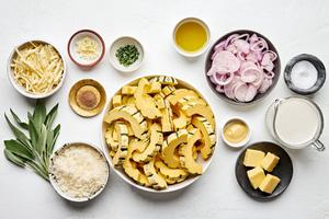 squash, butter, shallots, garlic, sage, thyme, cream, dijon, gruyere and Parmesan, ground nutmeg in prep bowls