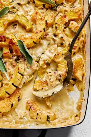 squash gratin made with cream, butter, shallots, nutmeg, thyme, sage, garlic, dijon, Parmesan and Gruyère