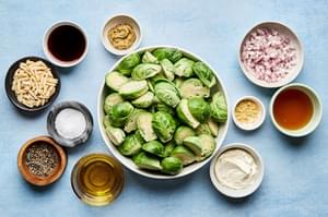 brussels sprouts, almonds, shallot, honey, stone ground mustard, mustard powder, sherry vinegar and creme fraiche in bowls
