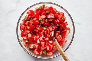diced fresh tomatoes, salt, fresh basil and olive oil in a bowl to make this easy bruschetta recipe