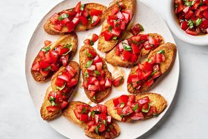 Easy homemade bruschetta recipe with fresh tomato, basil and garlic topping on grilled Italian bread
